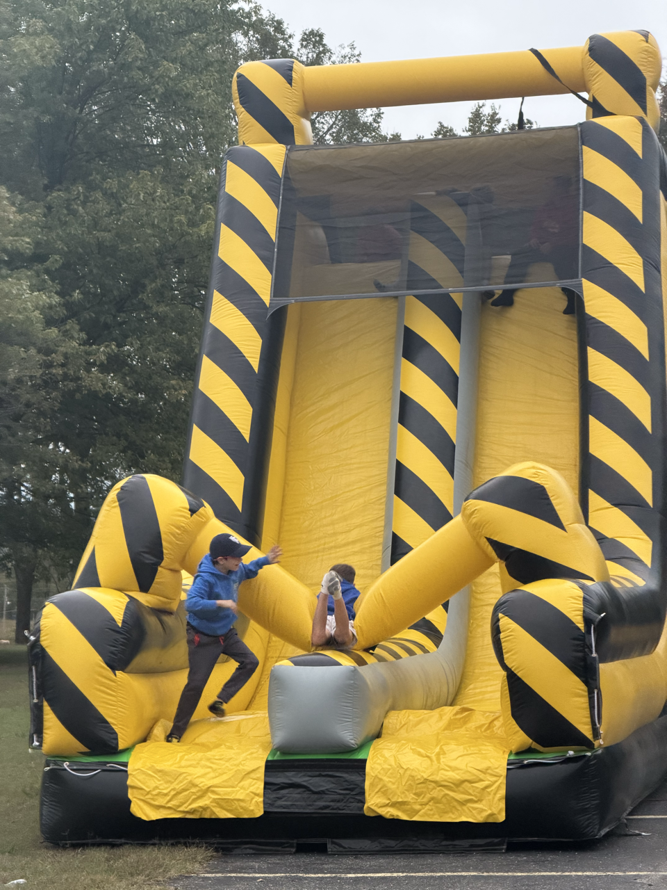 A tall inflatable slide setup outdoors.